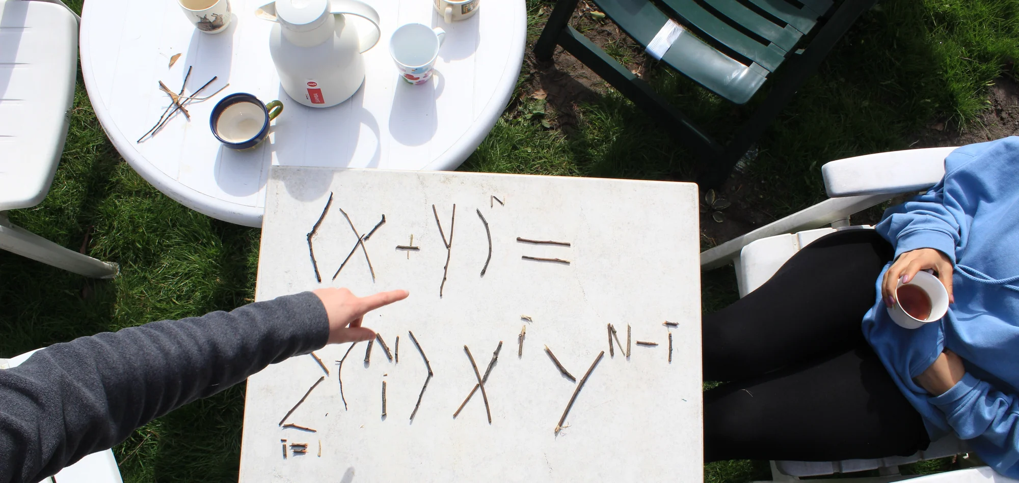 Sticks arranged on a table as a mathematical formula